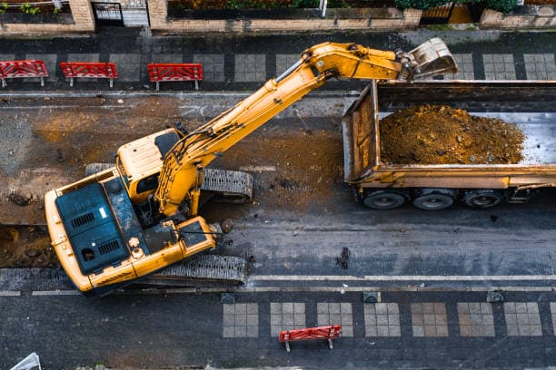 Track damage from an excavator turning on turf